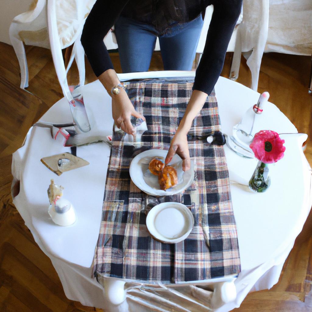 Woman setting table for breakfast